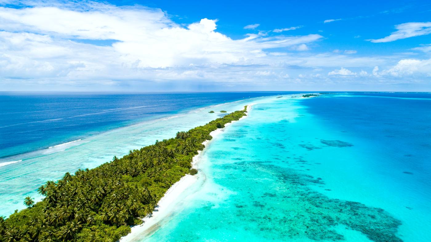 A secluded island surrounded by turquoise water